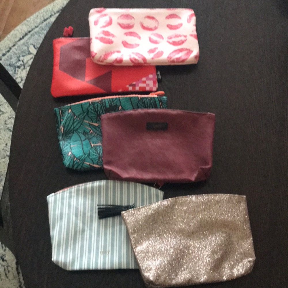 Six Ipsy makeup bags